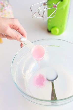 Someone pouring a substance in a bowl