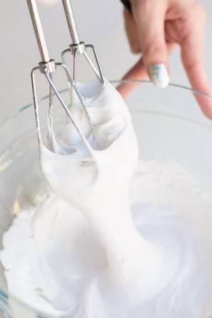 A whisk with a white substance on it