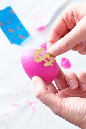 Pink egg with gold money sign