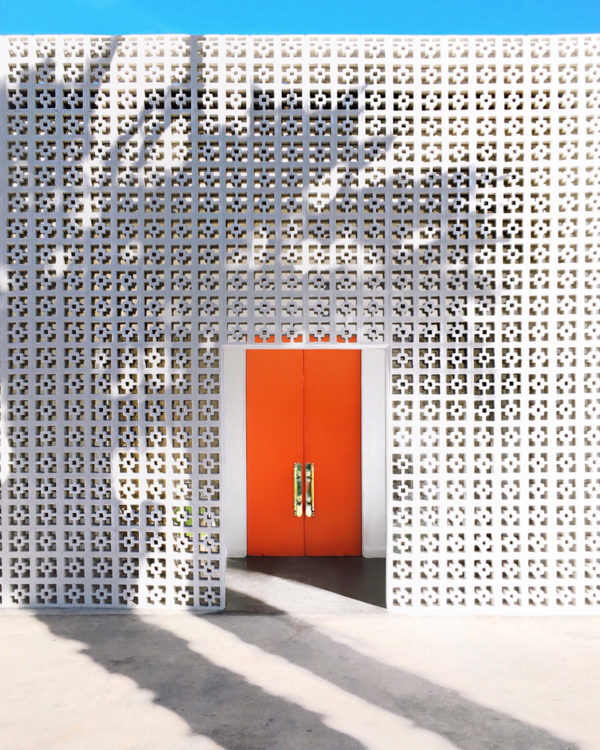 A building with an orange door