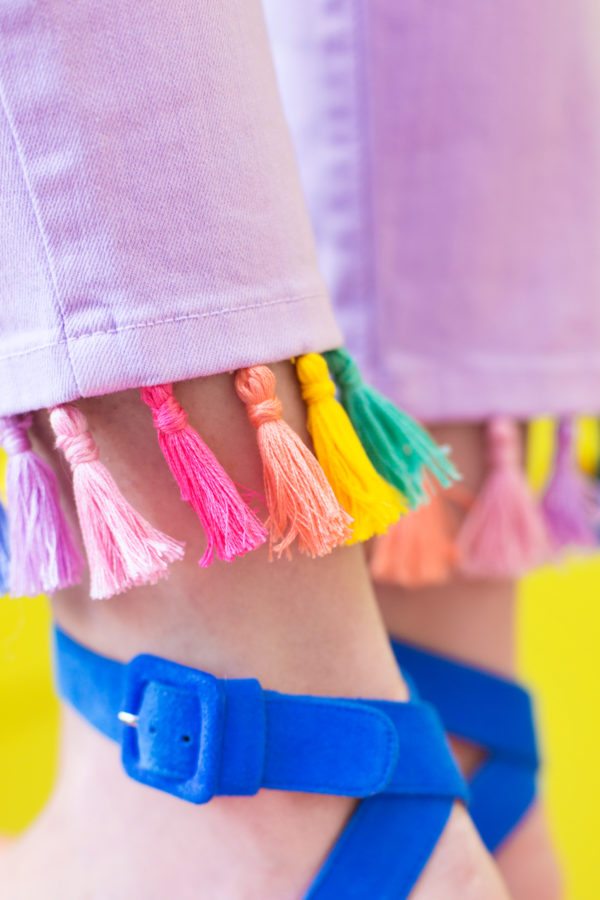 Purple jeans with rainbow tassels