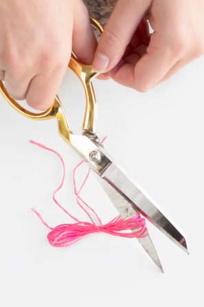 Scissors and pink string 