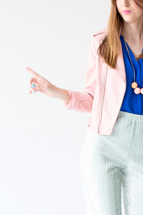 A woman wearing a pink jacket