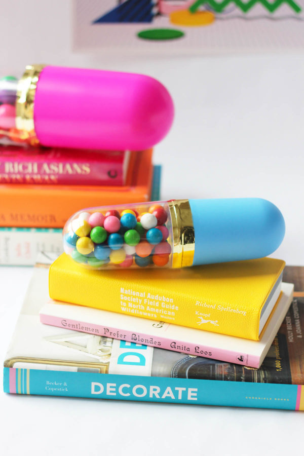 Sprinkle pill on a stack of books