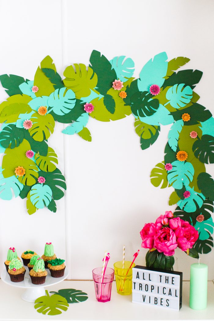 Tropical garland above a party table. 