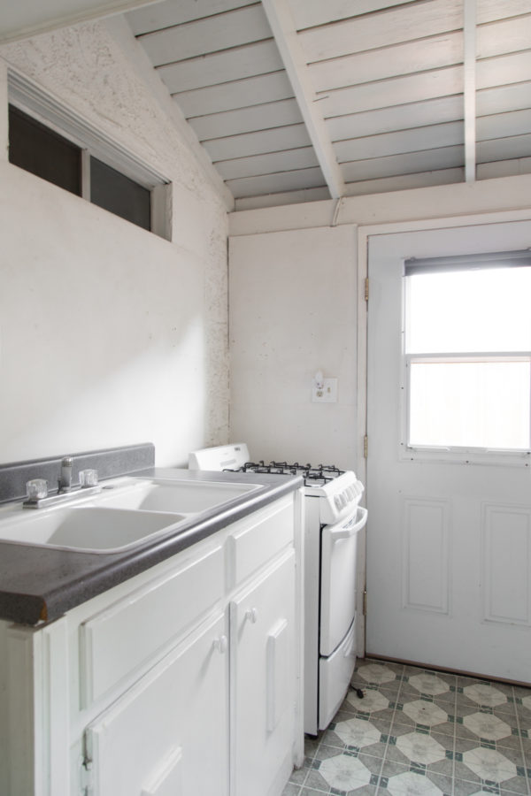 A kitchen with a sink and a window