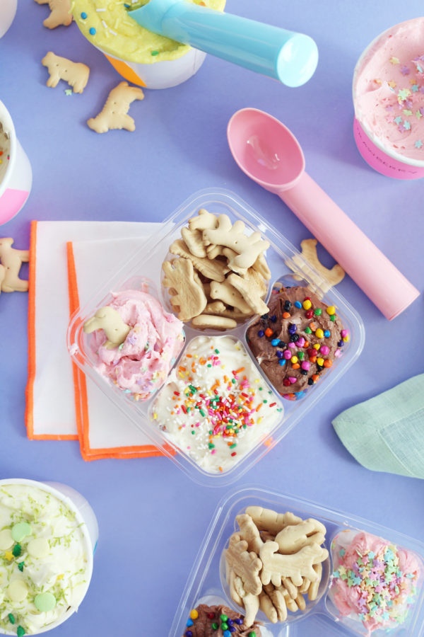A box filled with different types of food on a table, with Dunkaroos and Ice Cream