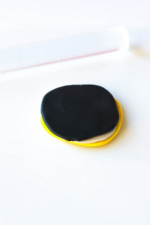 Black circle on yellow circle 