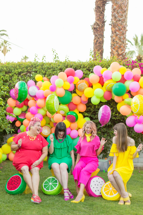 People in front of colorful balloons