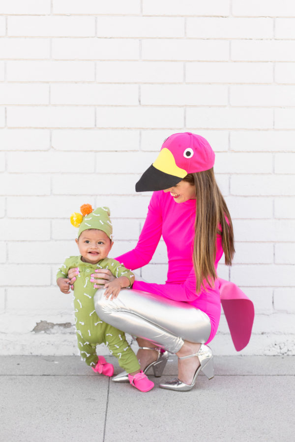 A woman dressed as a flamingo and a little boy dressed as a cactus