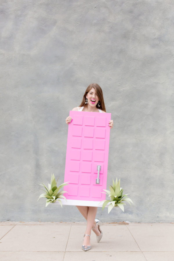 A woman dressed as a pink door