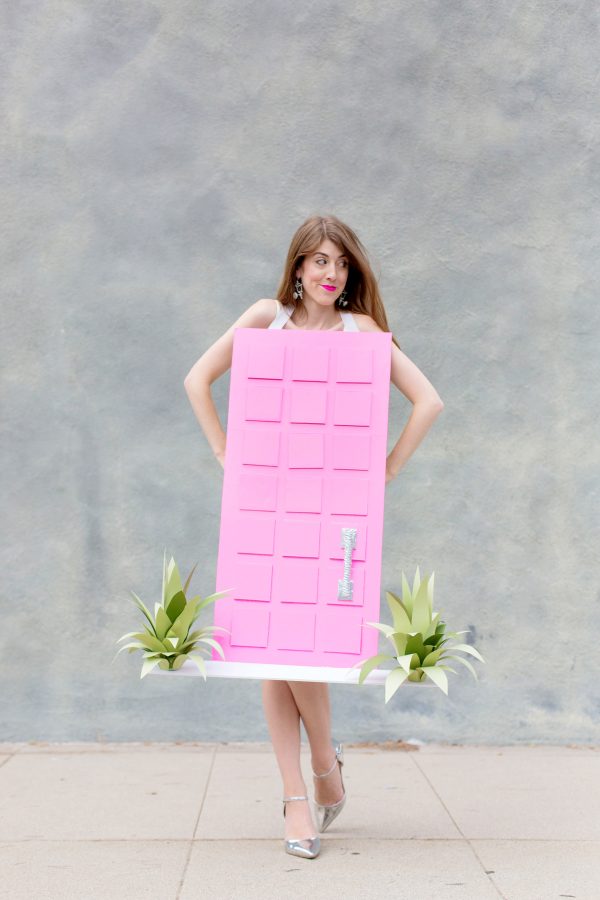 A woman dressed as a pink door