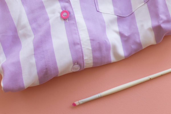 A close up of a purple and white striped shirt 