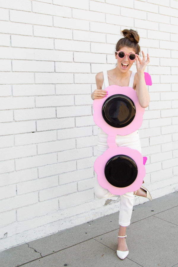 A woman dressed up as sun glasses 