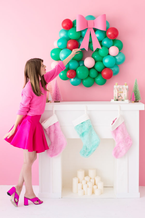 Someone touching a balloon wreath