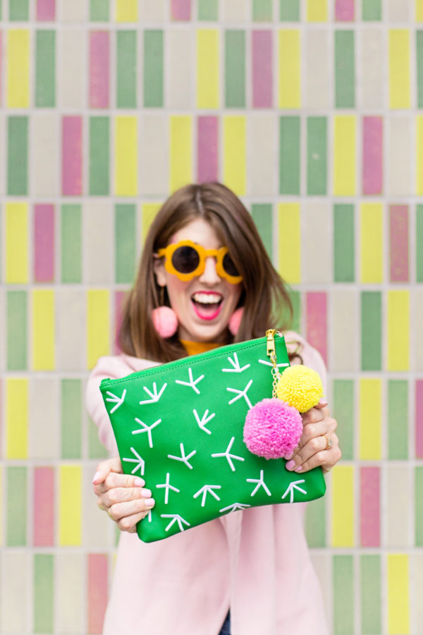 Someone holding a cactus clutch