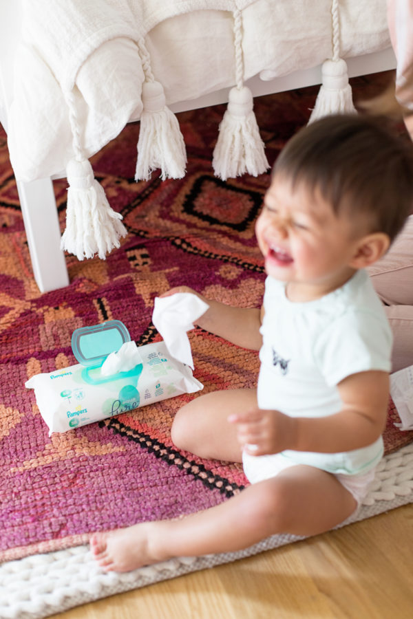 A baby sitting on the floor