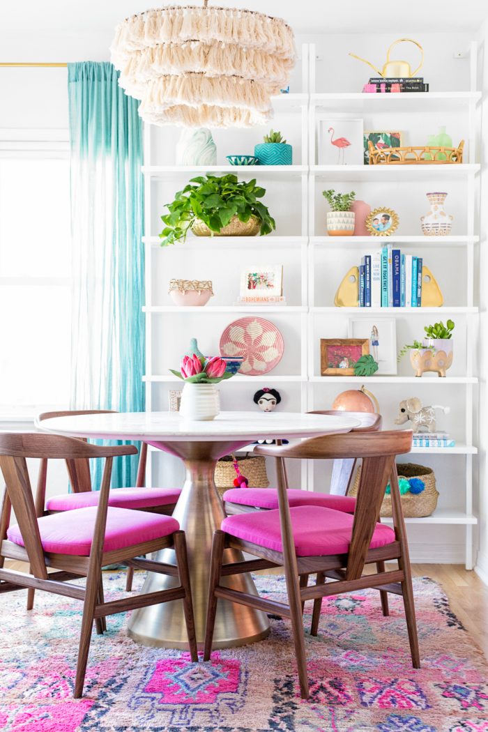 A dining room filled with shelves