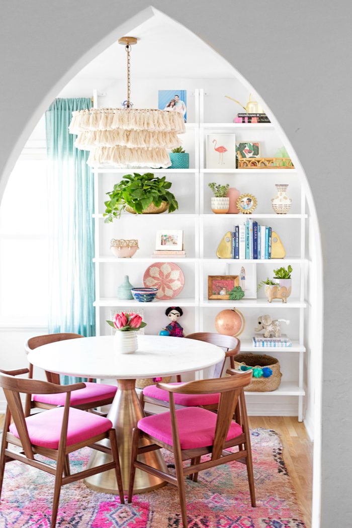 Dining room with pink chairs