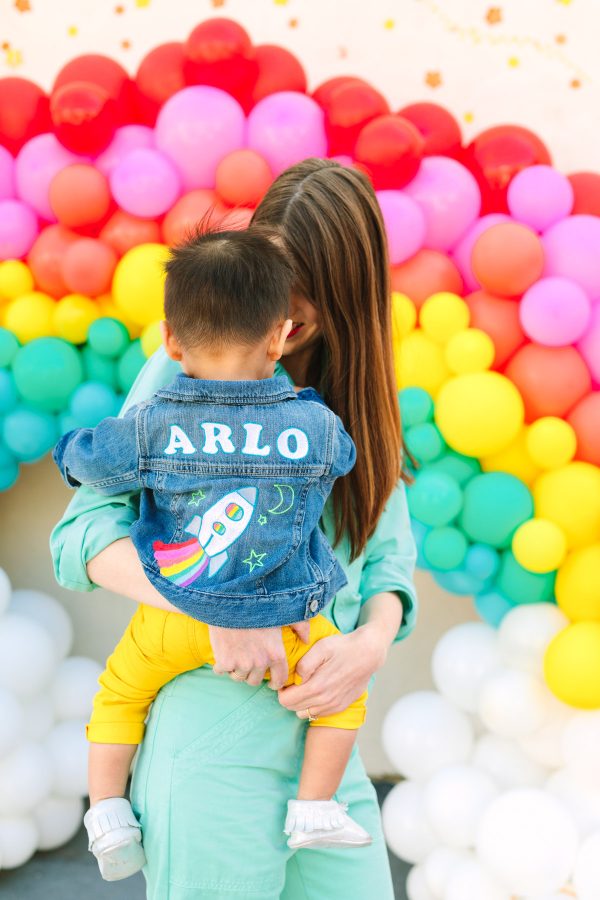 Rainbow balloons and people