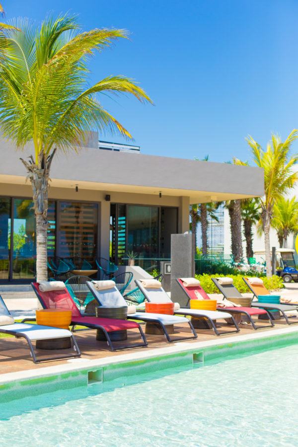 Pool chairs next to a pool