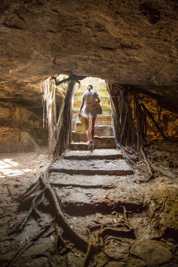 Someone walking through a cave