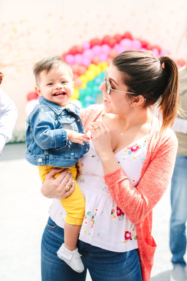 A woman holding a baby