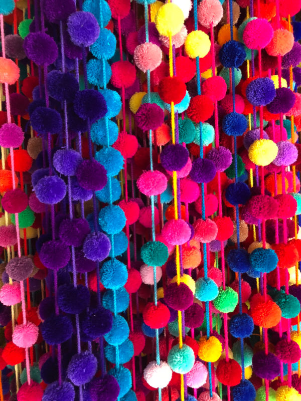 A group of colorful pom poms