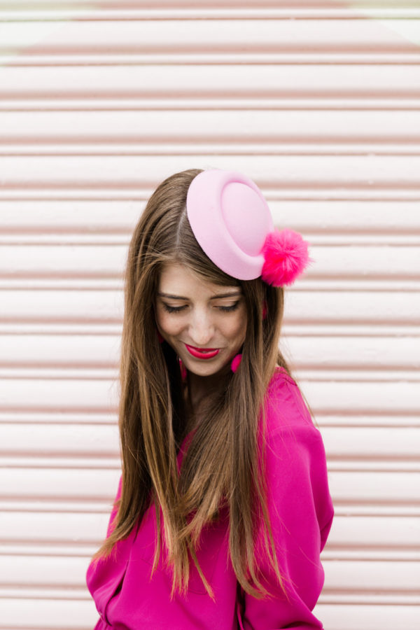 A woman wearing a pink hat