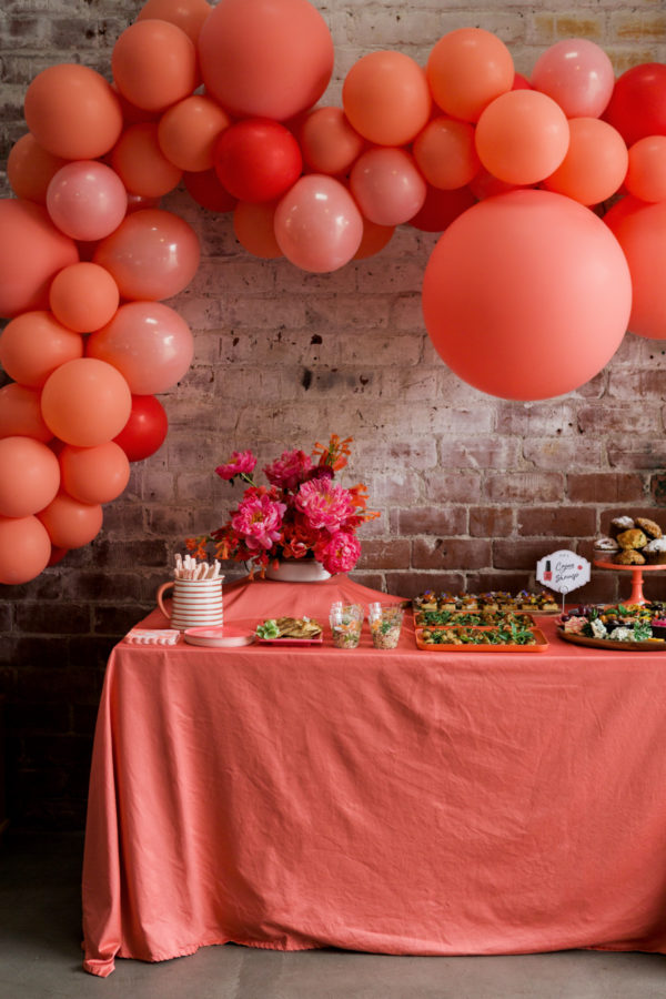 Balloons over a pink table