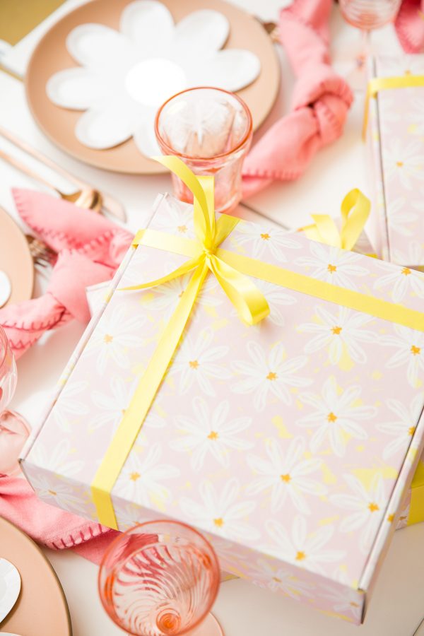 A box with flowers and ribbon