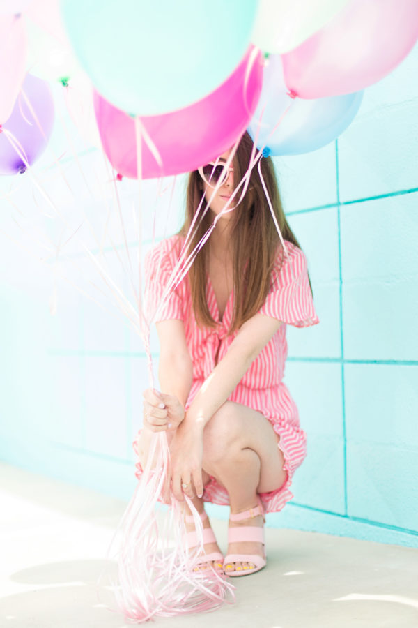 Someone holding balloons