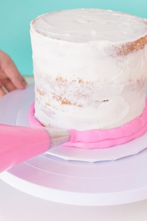 A cake with pink frosting