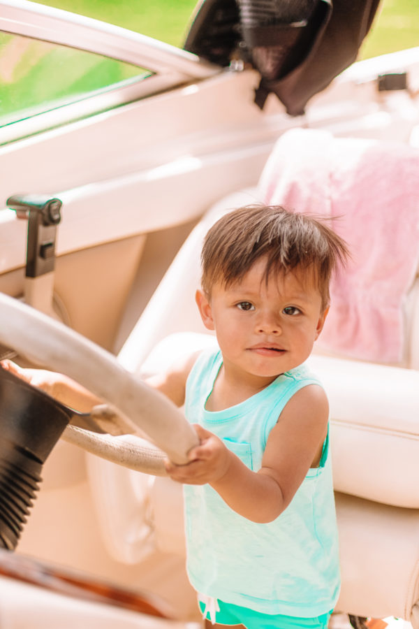 A little boy holding a wheel