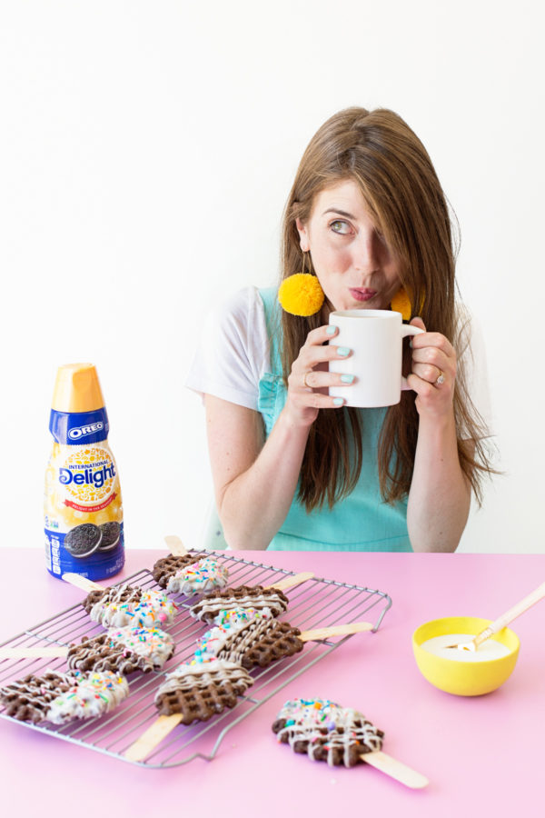 A woman drinking from a cup