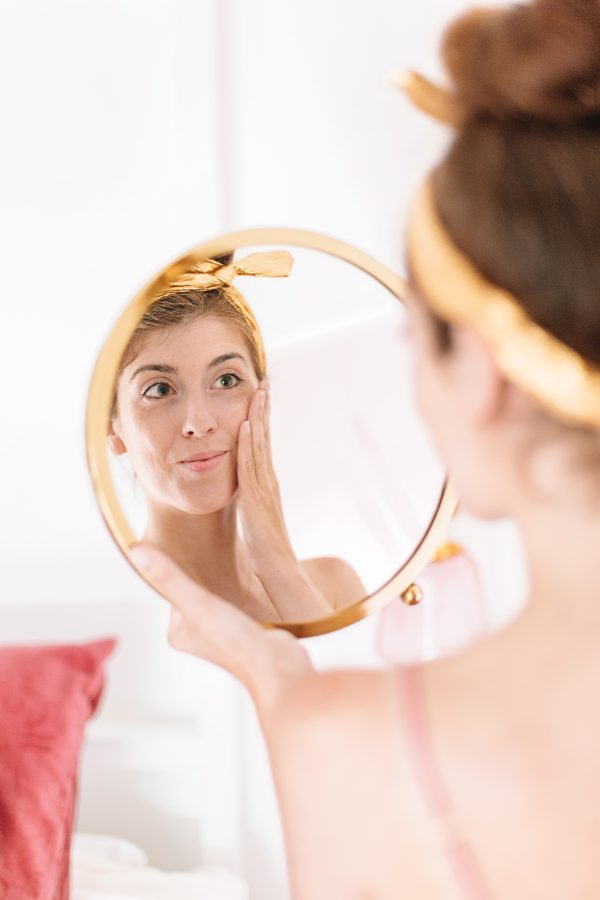 A woman looking into a mirror