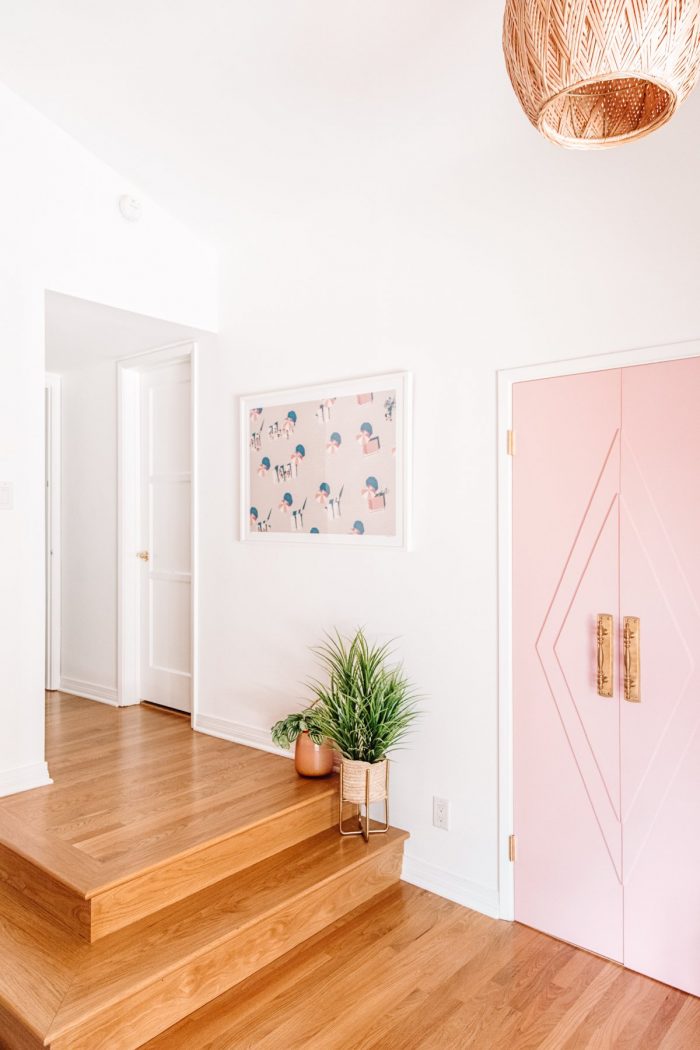 A room with a pink door