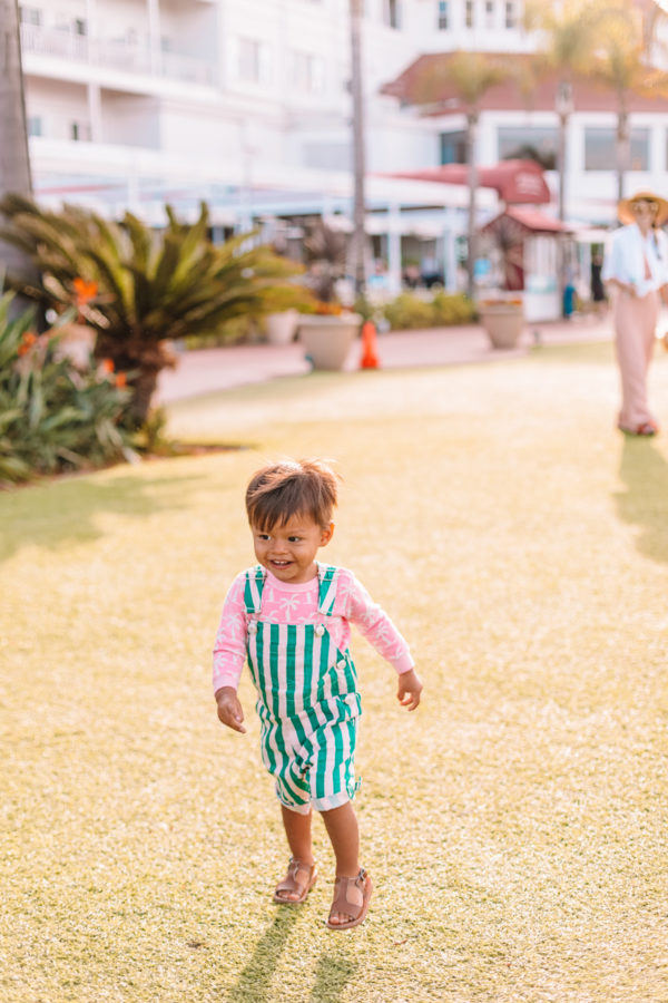 A little boy running on a path