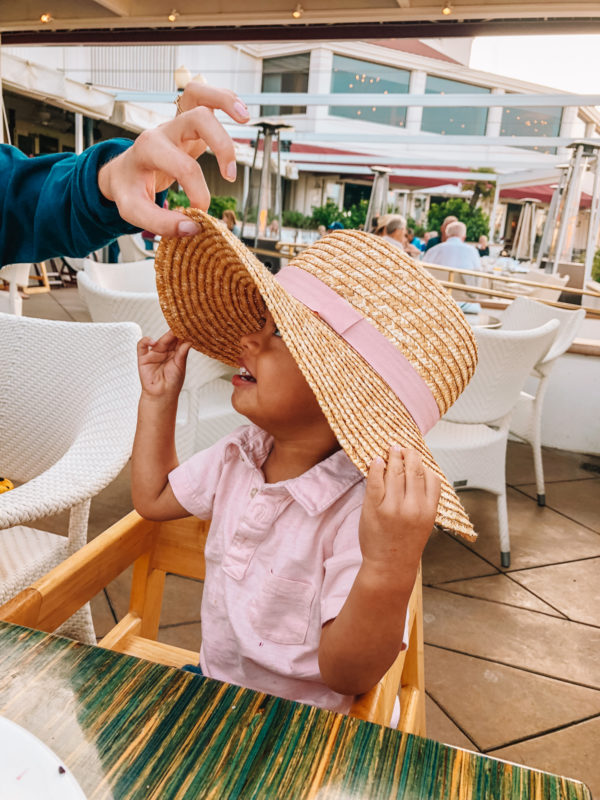 A little boy wearing a hat