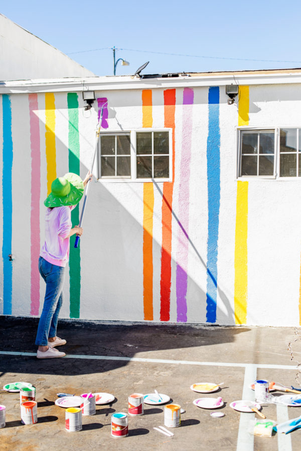 A person painting a wall