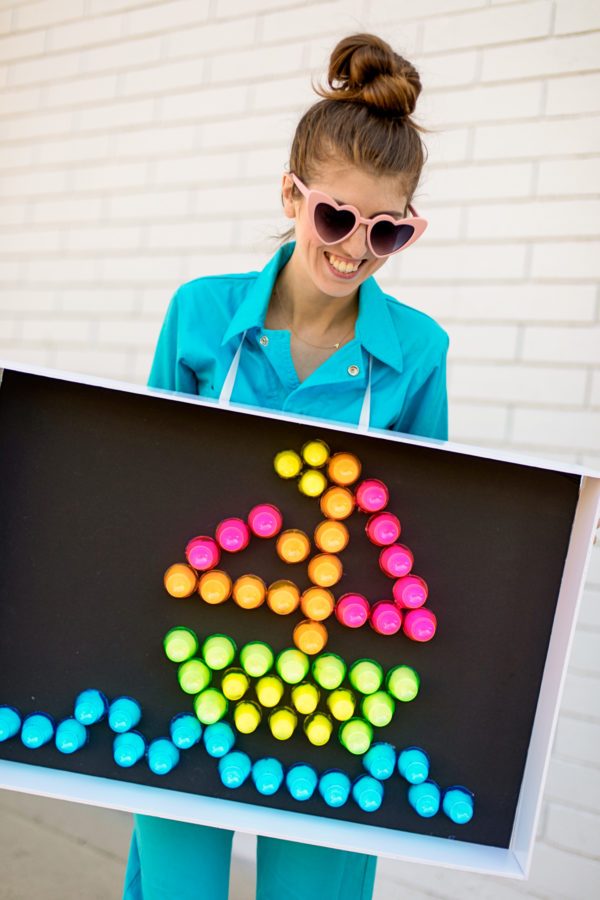 A woman holding a light brite