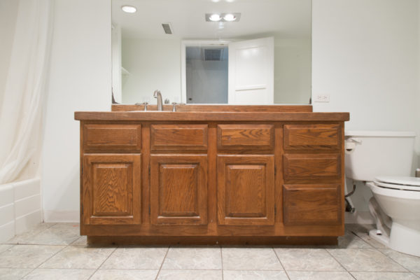 A bathroom with a wooden vanity