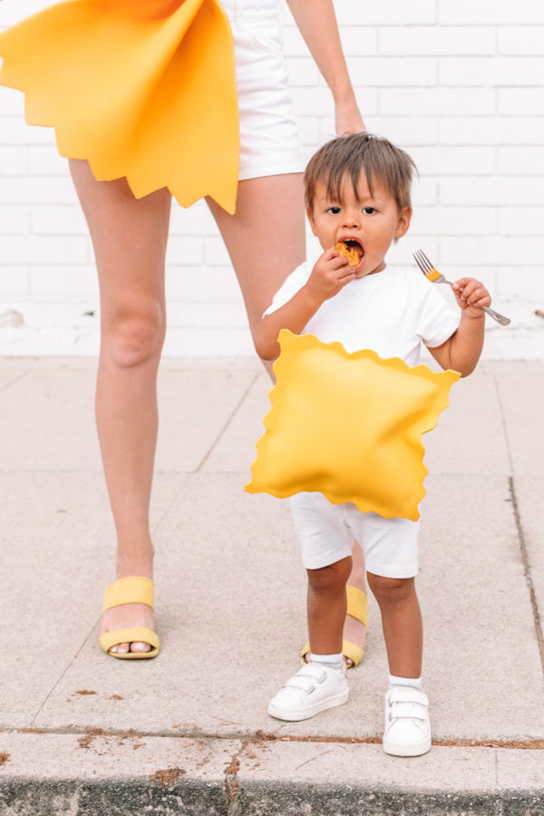 A baby dressed as pasta