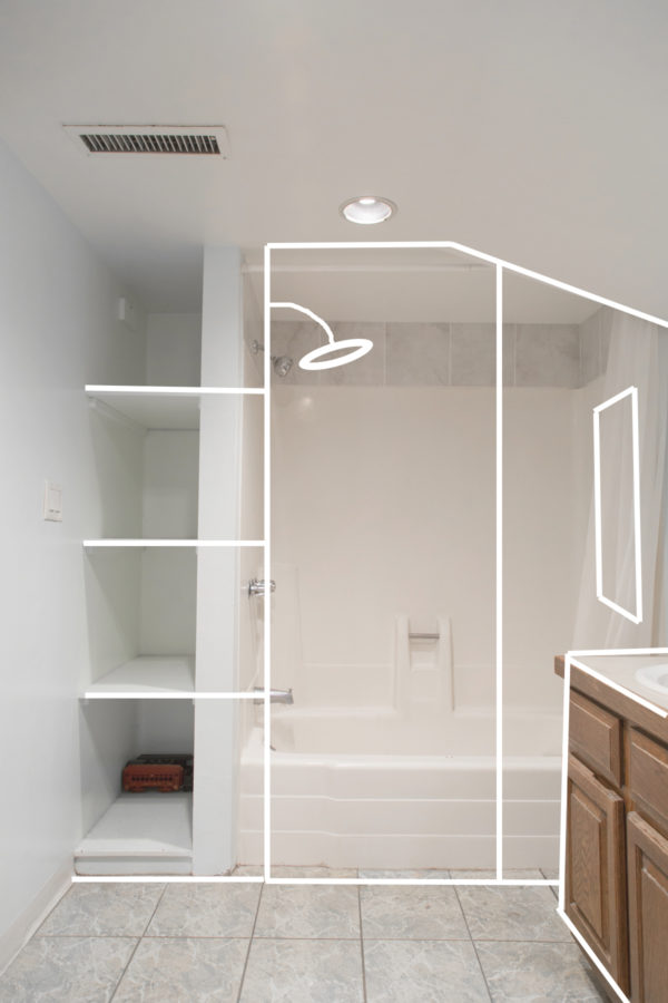 A bathroom with a shower and shelves