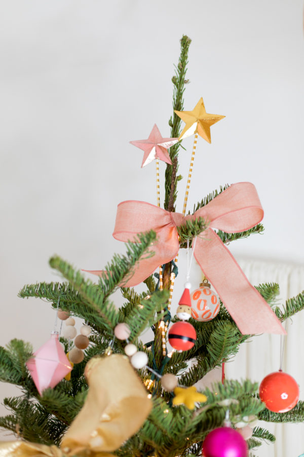 A bow on top of a christmas tree