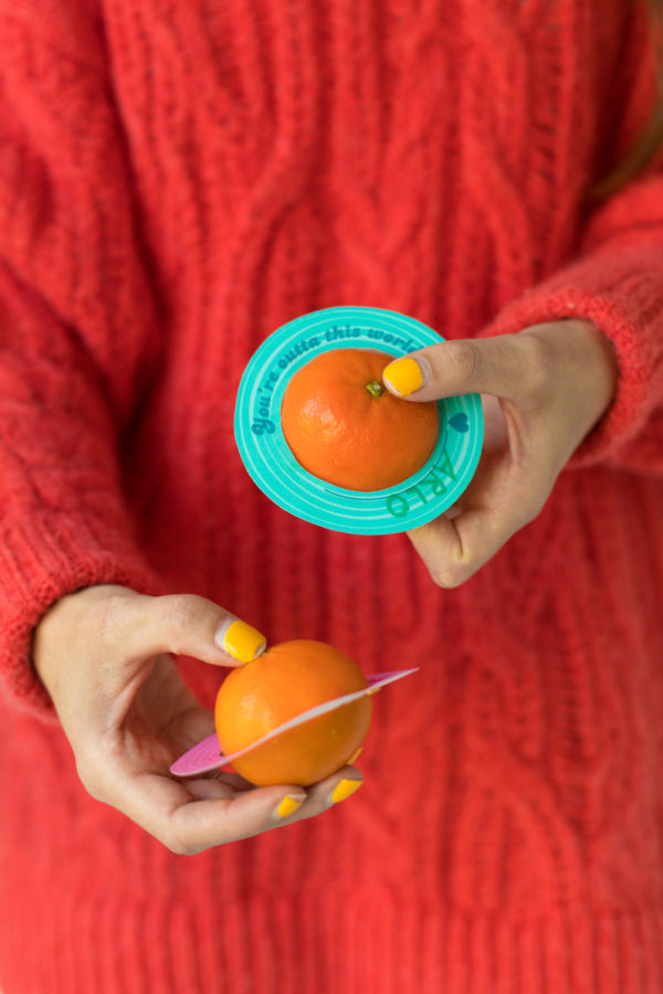 An orange with paper around it