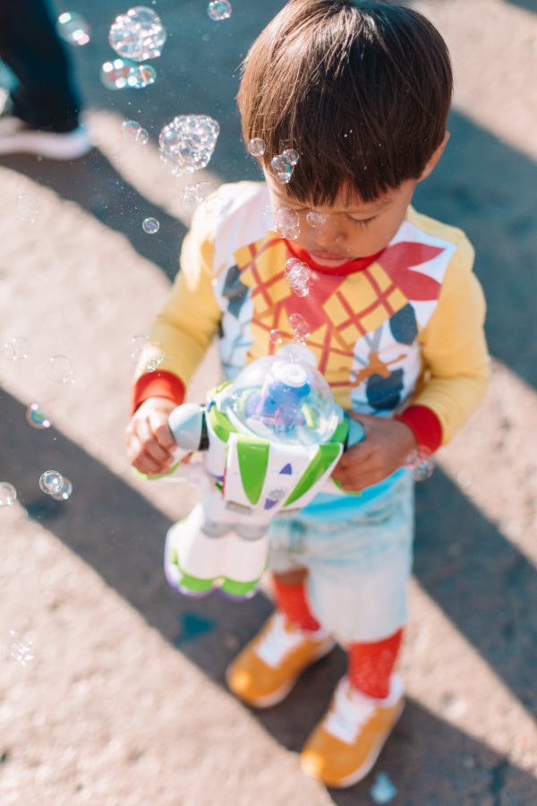 A little boy holding bubbles