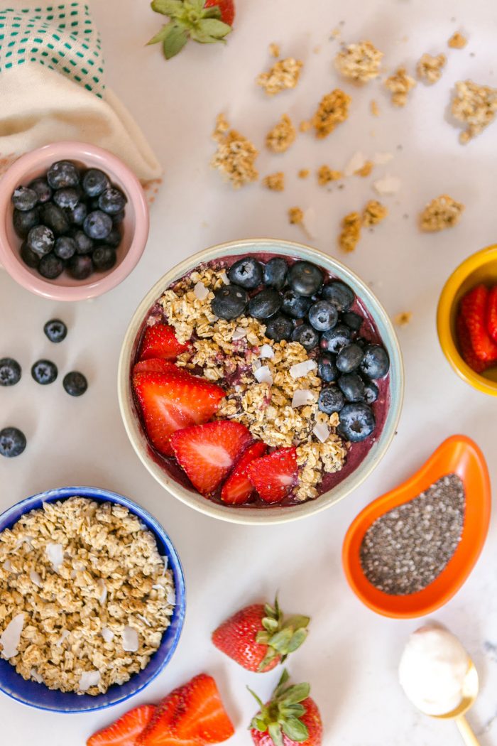 Berry Smoothie and Small Bowls of Toppings