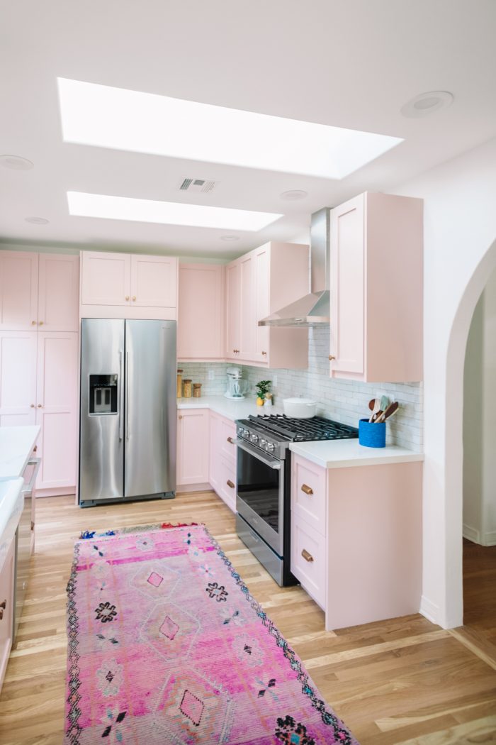 A kitchen with a wood floor