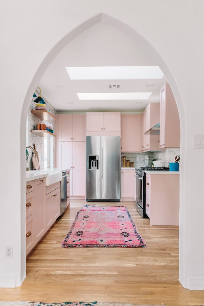 A kitchen with a wood floor